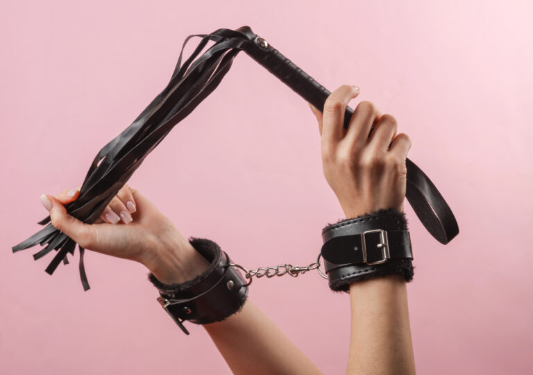 hands with whips and chain