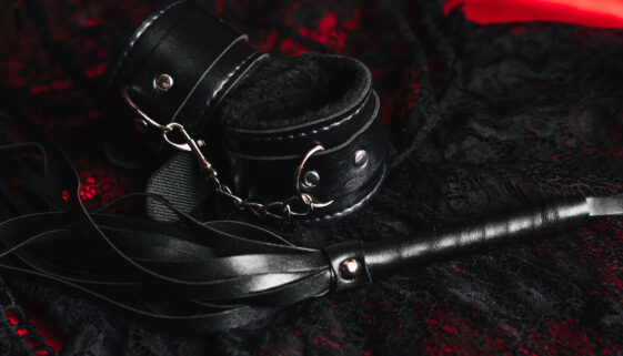 Handcuffs and a whip with women's sexy underwear