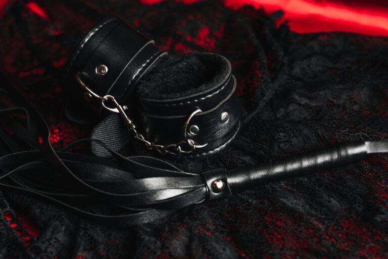 Handcuffs and a whip with women's sexy underwear